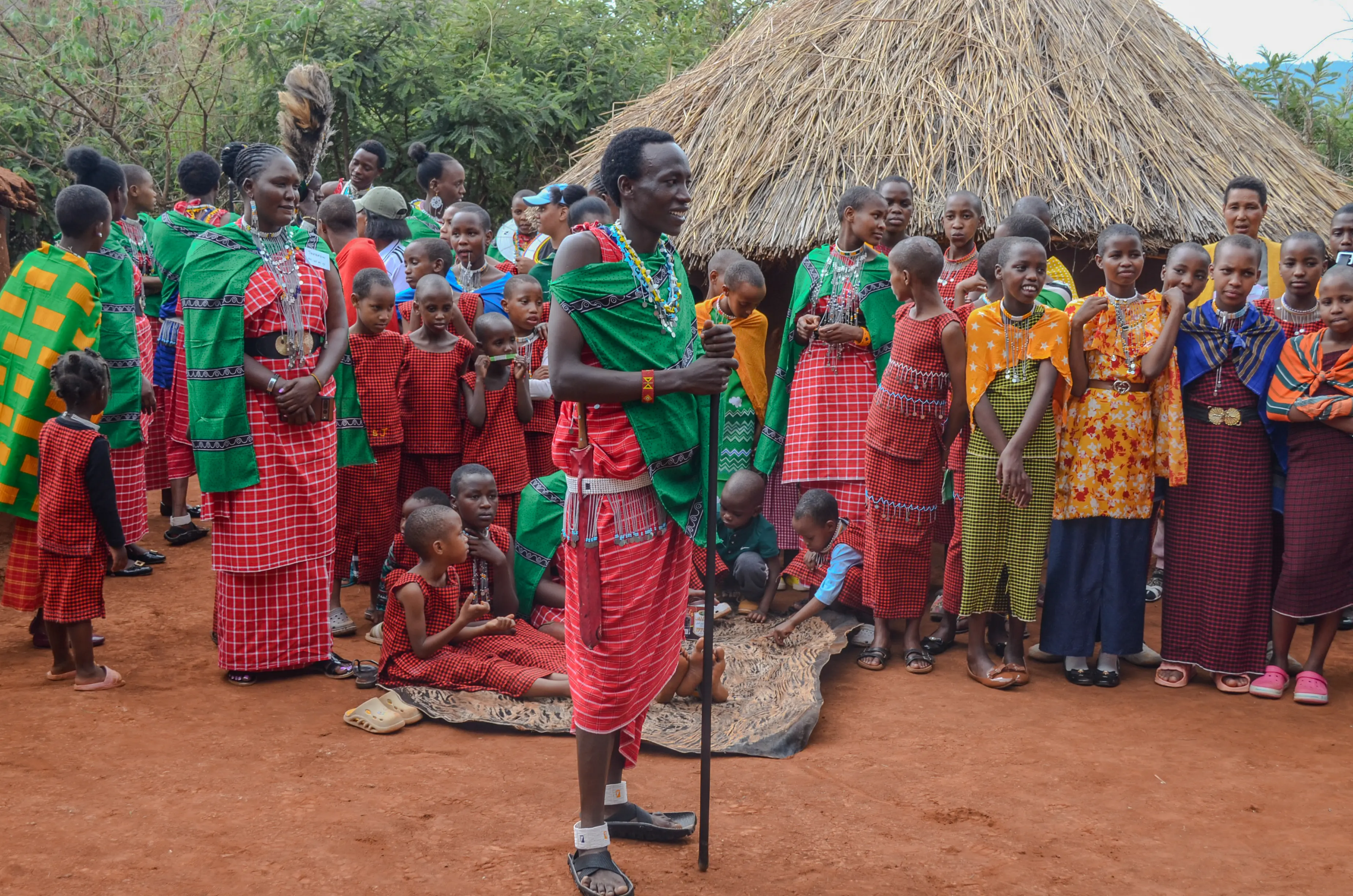 Massai community gathering with traditional attire at the maasai culture center in tanzania