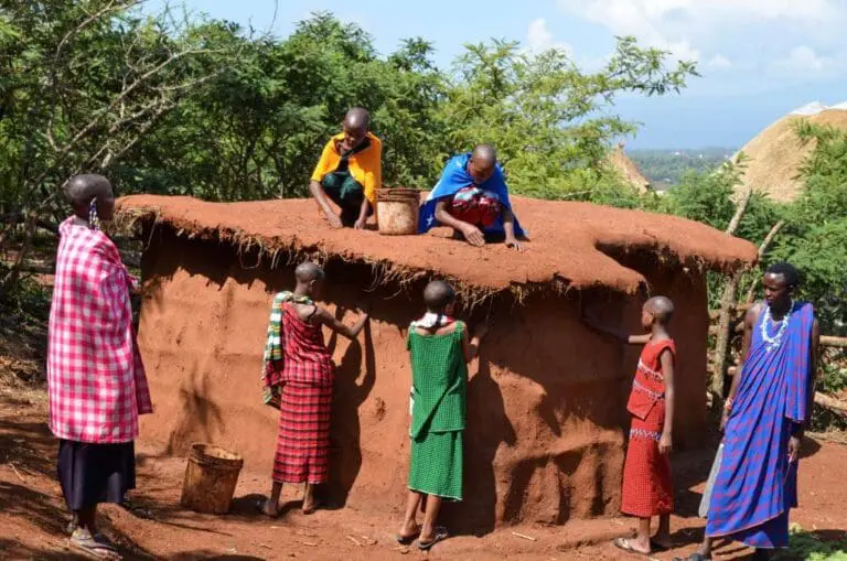 contact maasai culture center - Maasai girls building a boma under the guidance of maasai elders as of their maasai culture curriculum